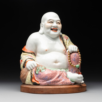 A large Chinese famille rose Milefo Buddha on wooden stand, 20th C.