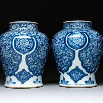 A pair of Chinese blue and white 'peony scroll' vases, Kangxi