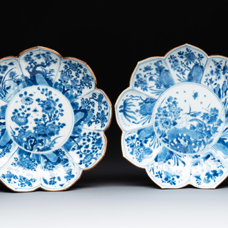 A pair of Chinese lotus-shaped blue and white plates with floral design, yu mark, Kangxi