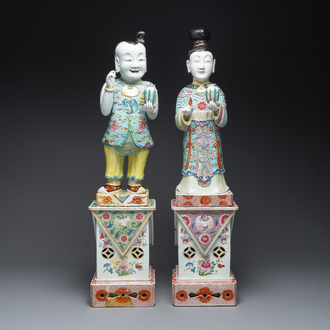 A pair of large Chinese famille rose figures on stands, Qianlong