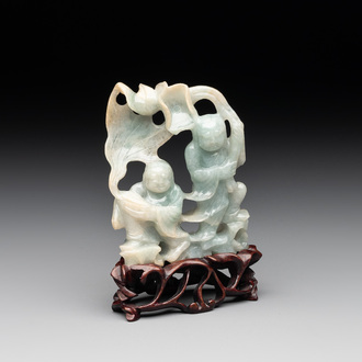 A Chinese jade 'He He Er Xian' group on wooden stand, 19th C.