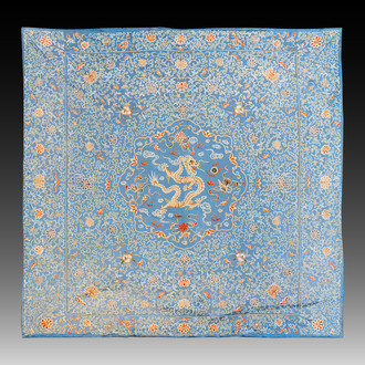 A Chinese blue-ground embroidered silk panel with a dragon among bajixiang, 19th C.