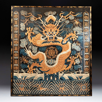 A Chinese embroidered silk tapestry with a five-clawed dragon among clouds and bajixiang, 18/19th C.