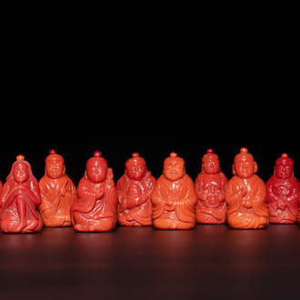 A set of ten Chinese coral-red glass Luohan-form snuff bottles, 20th C.