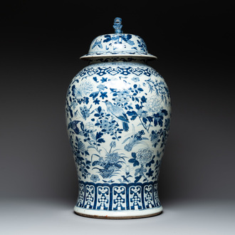 A large Chinese blue and white 'birds among blossoming branches' vase and cover, 19th C.