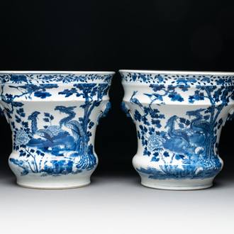 A pair of Chinese blue and white 'birds among flowering branches' jardinières, 19th C.