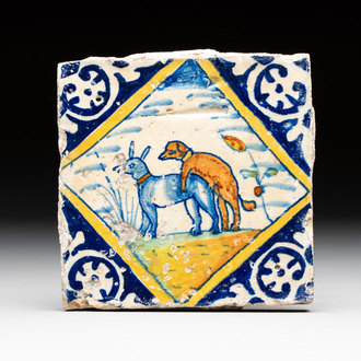 A polychrome Dutch Delft maiolica 'mating dogs' tile, late 16th C.