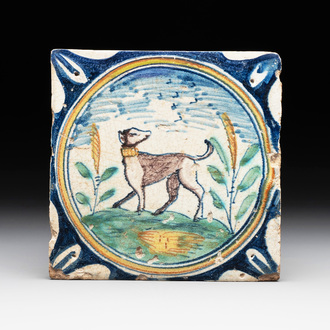 A polychrome Dutch Delft maiolica 'medallion' 'dog' tile, late 16th C.