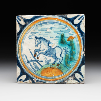 A polychrome Dutch Delft maiolica 'medallion' 'horse' tile, late 16th C.