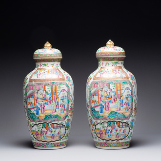 A pair of Chinese Canton famille rose vases and covers with narrative design, 19th C.