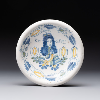 A rare polychrome Dutch Delft 'King William' dish inscribed 'KV GBT', 17th C.