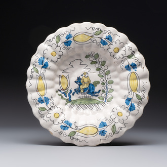 A rare polychrome Dutch Delft 'Chinese horserider' dish, 17th C.