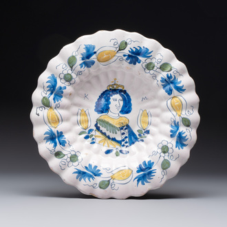 A polychrome Dutch Delft 'Queen Mary' dish inscribed 'K M', 17th C.