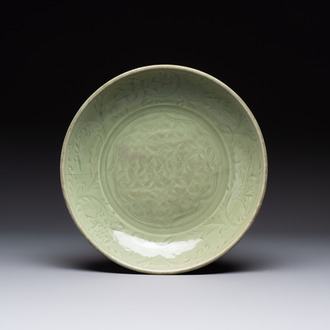 A Chinese Longquan celadon dish with floral design, Ming