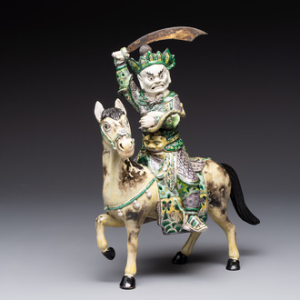 A fine Chinese verte biscuit sculpture of a Heavenly King on horseback, 19th C.