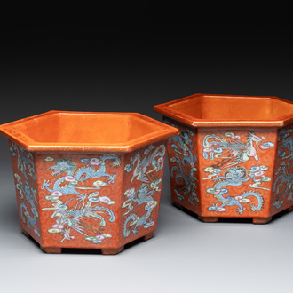 A pair of Chinese coral-red-ground 'dragon and phoenix' jardinières, Qianlong mark, 19th C.