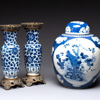 A pair of Chinese blue and white bronze-mounted vases and a covered jar, 19th C.