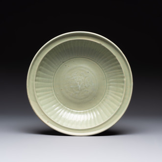 A Chinese Longquan celadon plate with floral design, Yuan/Ming