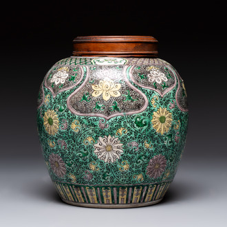 A Chinese verte biscuit 'lotus scroll' jar with wooden cover, Qing