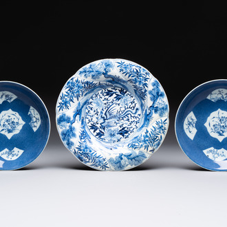 A Chinese blue and white 'phoenix and monkeys' dish and a pair of powder-blue-ground plates, Kangxi/Yongzheng