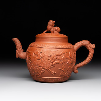 A Chinese Yixing stoneware 'phoenix and peonies' teapot and cover, Kangxi