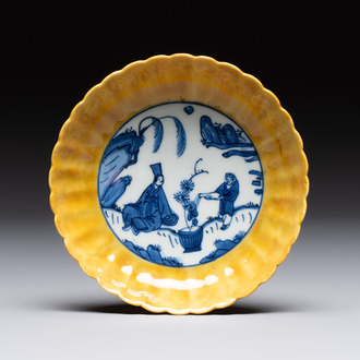 A rare Chinese blue and white yellow-glazed border chrysanthemum-shaped plate with figural design, hare mark, Jiajing