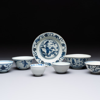 Four Chinese blue and white bowls, two cups and a plate, Ming