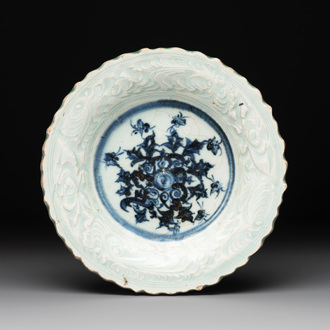 A Chinese blue and white celadon-ground plate with floral design, Ming