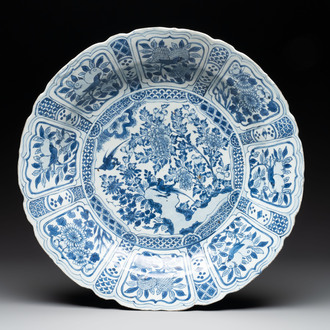 A large Chinese blue and white 'kraak' dish with birds among flowering branches, Wanli