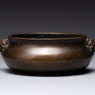 A Chinese bronze censer with lion-form handles, 大明宣德五年監造工部官監吳邦佐造 mark, 18th C.