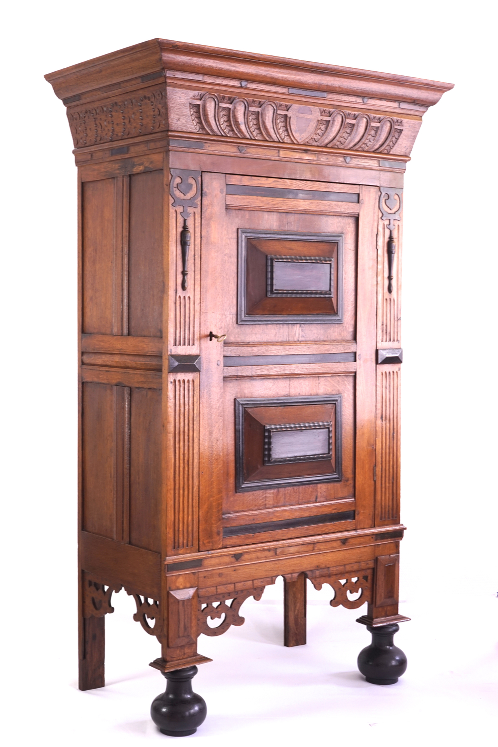 A neo renaissance one door oak cabinet, 19th C.