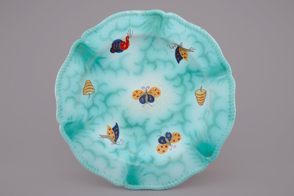 A Brussels faience dish with butterflies and caterpillars, 19th C.