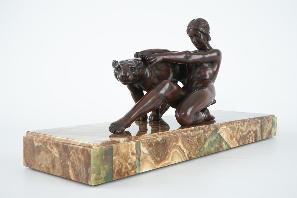Alexandre Ouline, Art Deco group of a lady with a panther, bronze on onyx base, 20th C.