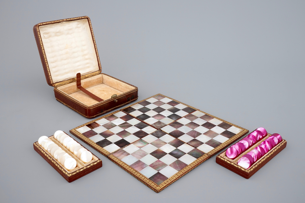 A leather traveller's checkers game set with mother of pearl game pieces, 19th C.
