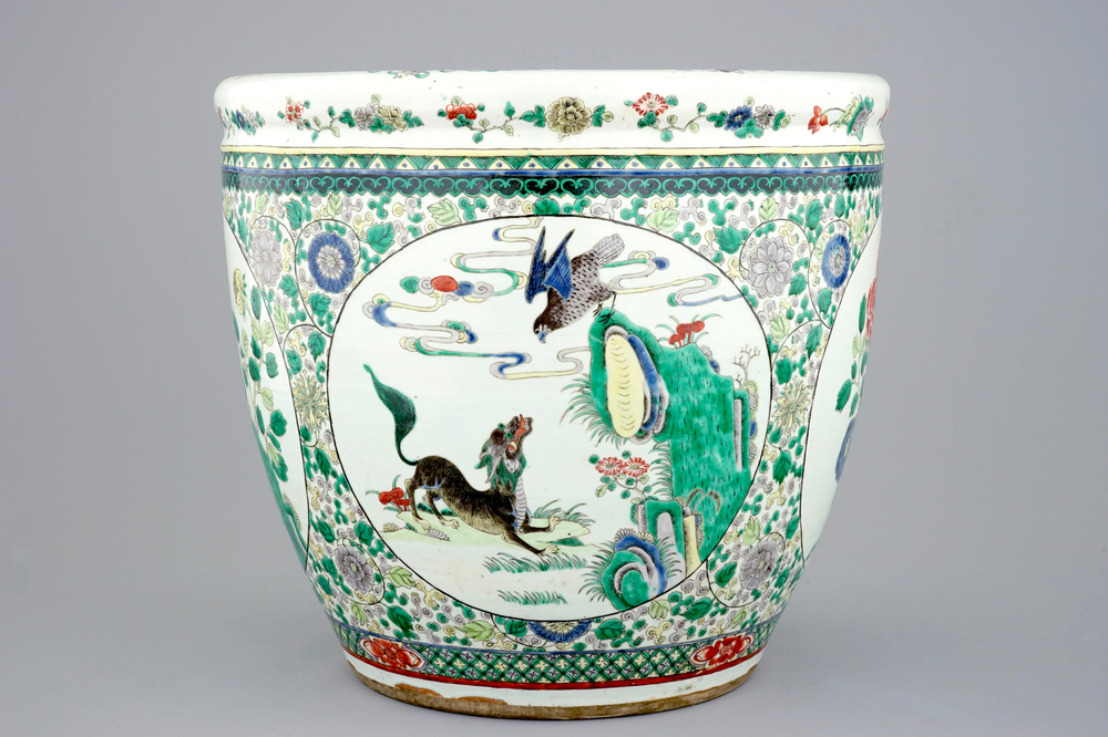 A large Chinese famille verte fish bowl with mythological animals, 19th C.