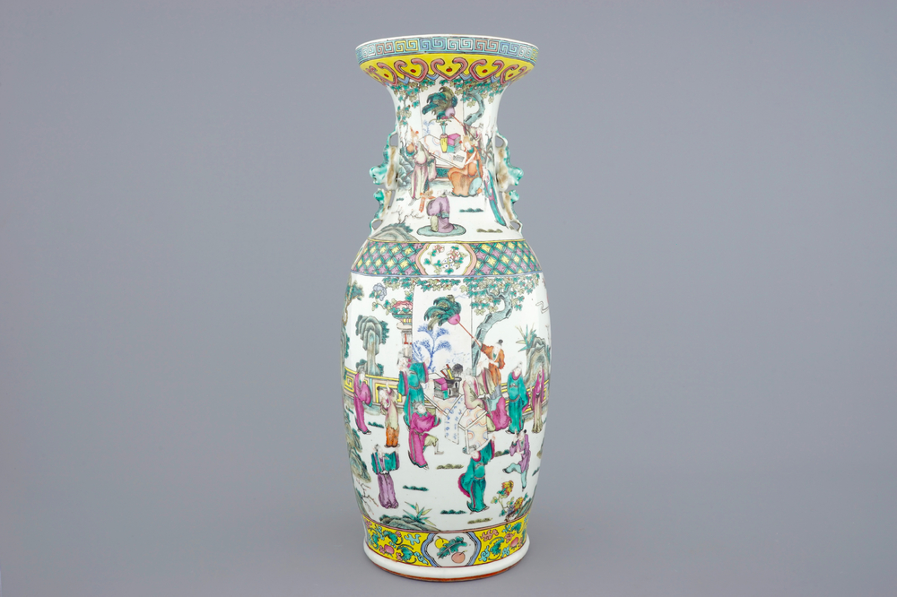 A tall Chinese famille rose vase with a garden scene, 19th C.