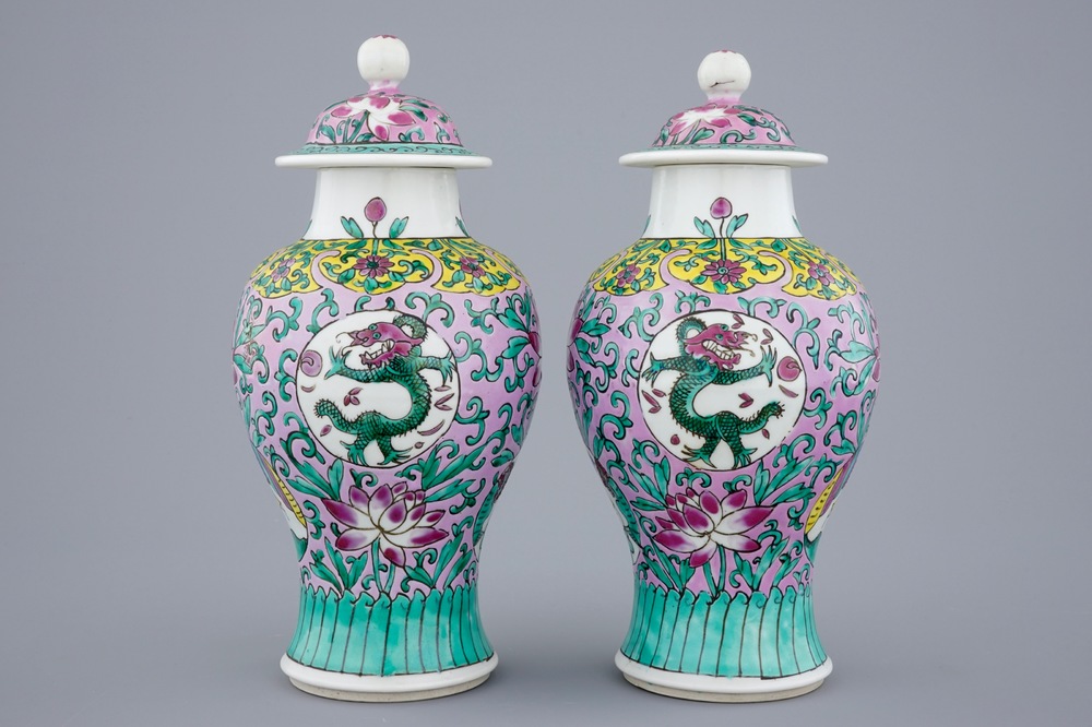 A pair of Chinese famille rose vases and covers, 19/20th C.