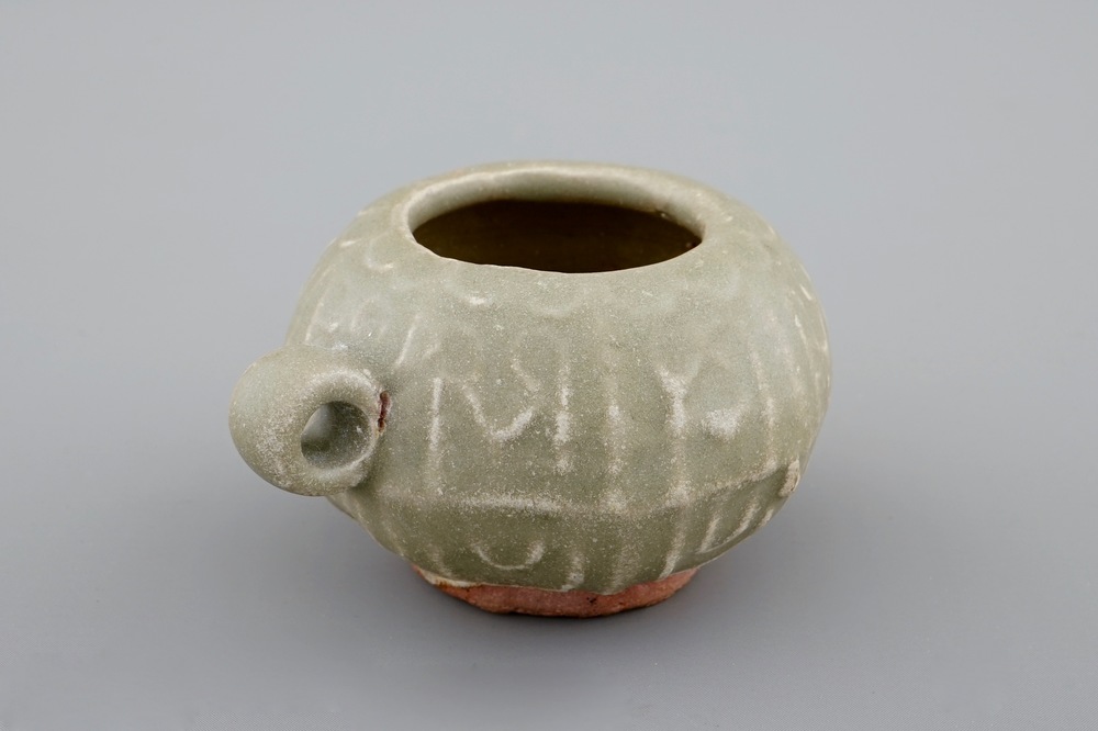 A Chinese celadon bird feeder, late Ming Dynasty