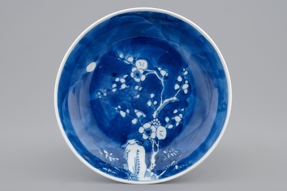 A Chinese blue and white saucer dish with prunus branch, Yongzheng mark and of the period
