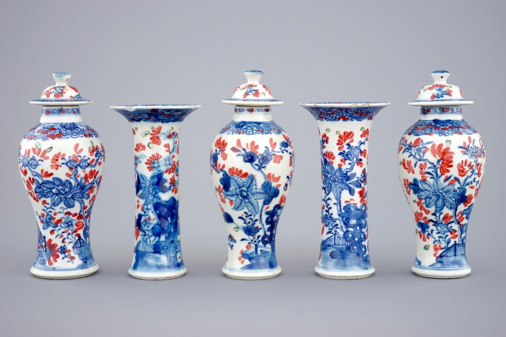 A small Chinese partly clobbered blue and white five piece garniture, Qianlong, 18th C.