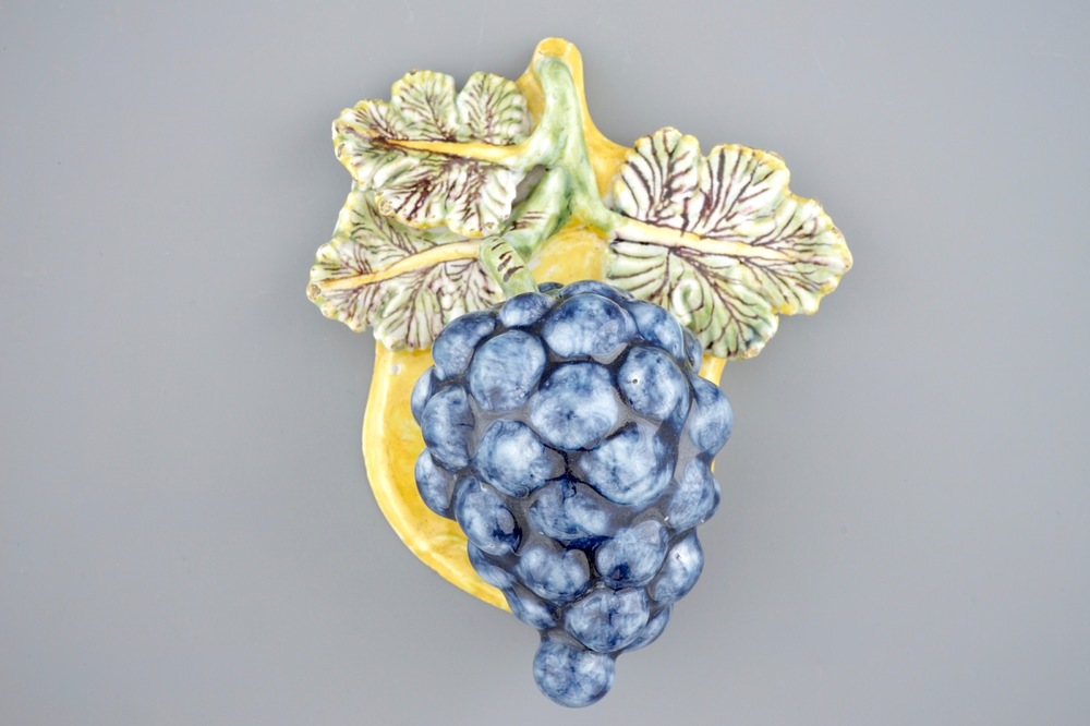 A rare intact Dutch Delft polychrome bunch of grapes, 18th C.