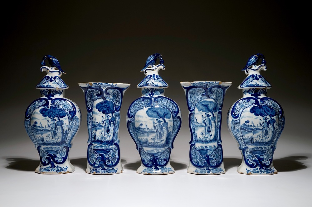 A Dutch Delft blue and white five-piece garniture with a hunter, 19th C.