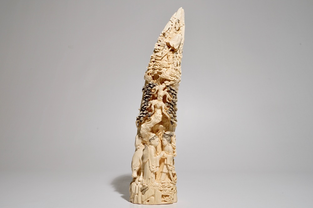 A Chinese carved ivory tusk with a marriage scene, ca. 1900