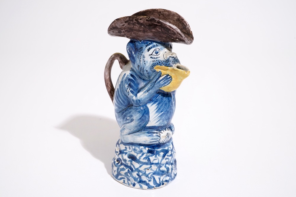 A polychrome Dutch Delft milk jug in the shape of a monkey, 19th C.