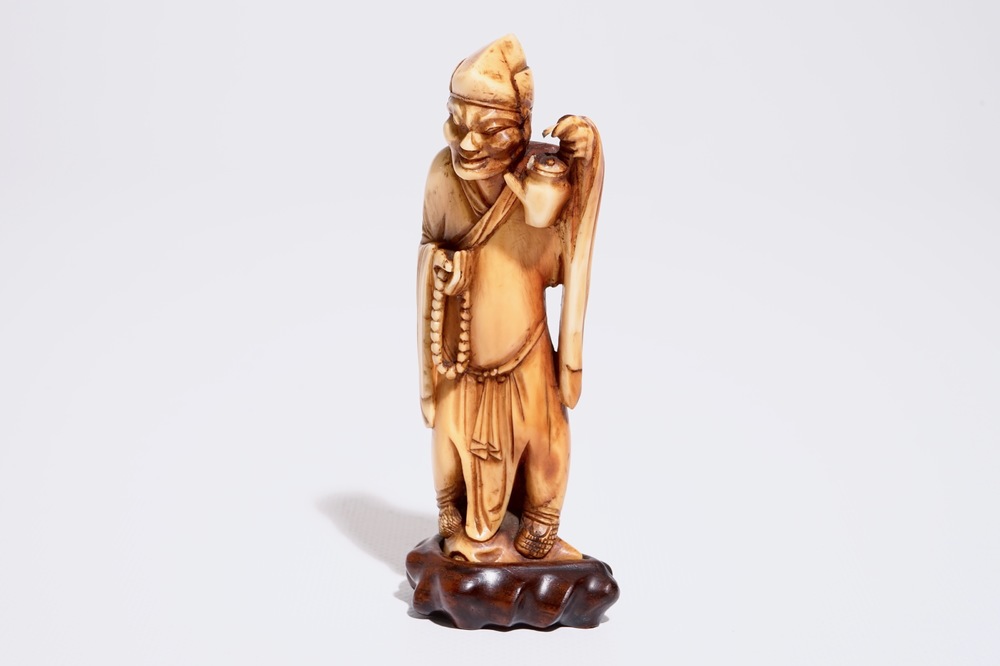 A Chinese carved ivory figure of a sage with a teapot, 18th C