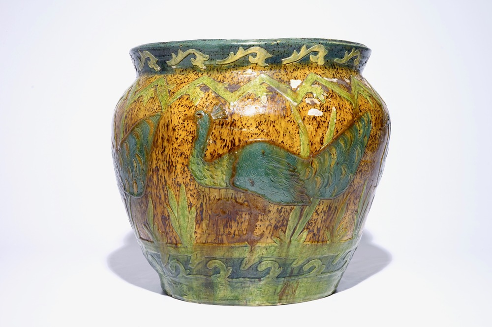 A Flemish pottery jardiniere with peacocks, signed LMV, Torhout, ca. 1900