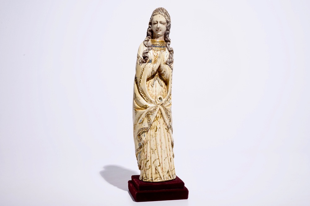 A tall Indo-Portuguese polychrome ivory model of a Madonna, Goa, 17h C.