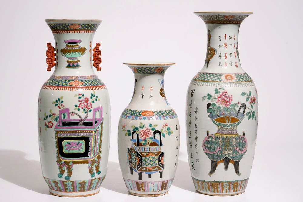 Three Chinese famille rose and verte vases with incense burners and jardinieres, 19th C.