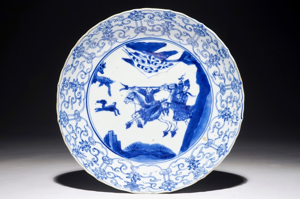 A Chinese blue and white fluted plate with a hunting scene, Kangxi