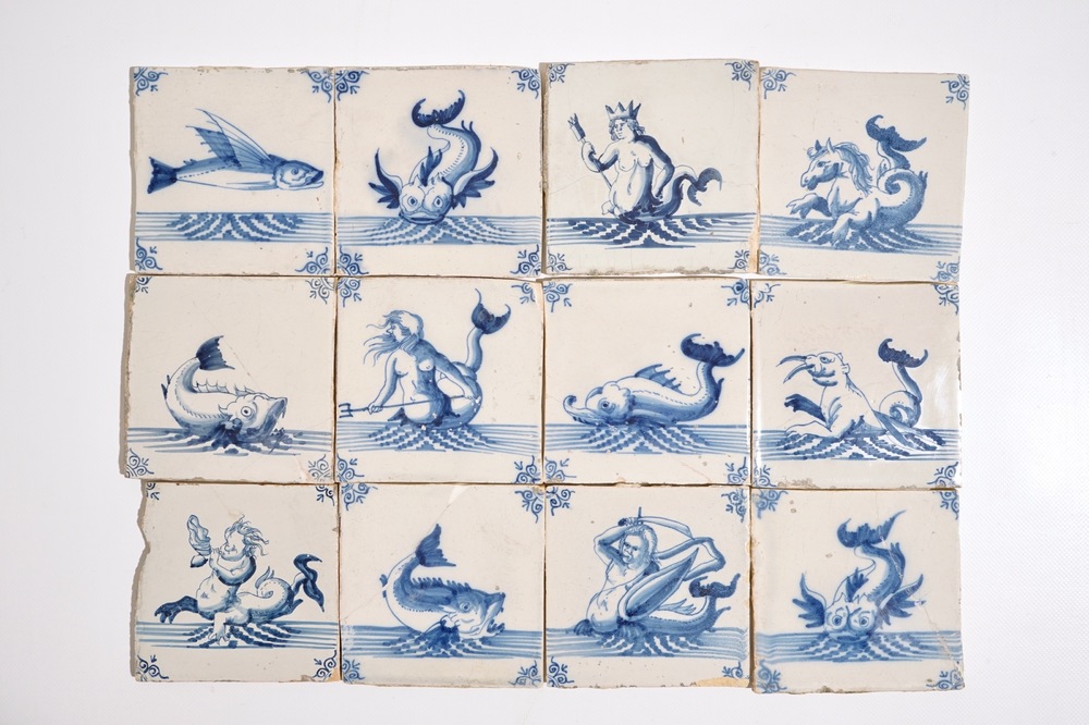 Twelve Dutch Delft blue and white seacreature tiles, 17th C.